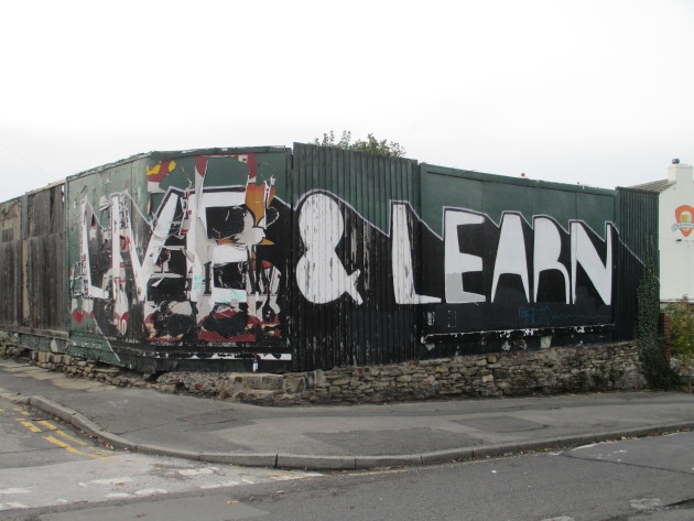 Graffiti writing with the words 'Live & Learn'